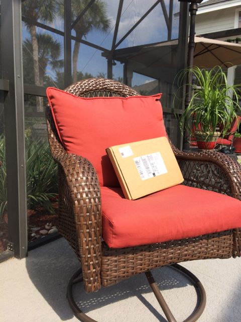 Mid Life Celebration book package on poolside chair 