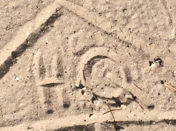 Mid Life Celebration logo drawn in sand