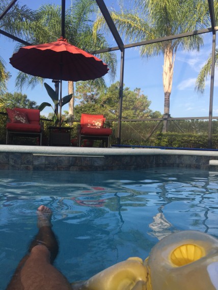 Floating in a pool raft near Disney World