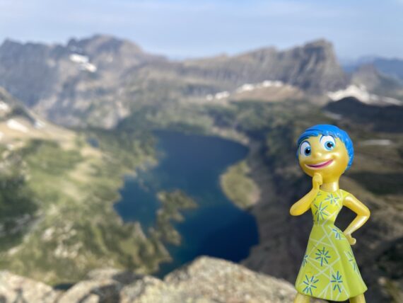 Pixar character figurine in mountains