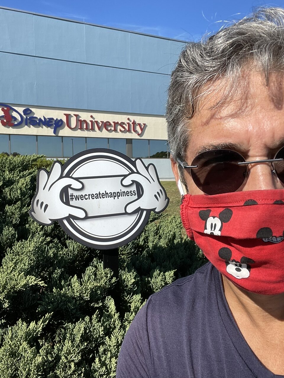 Man with Mickey Mouse face mask at Disney University