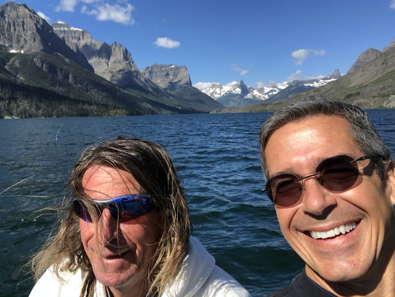 two men on a mountain lake boat