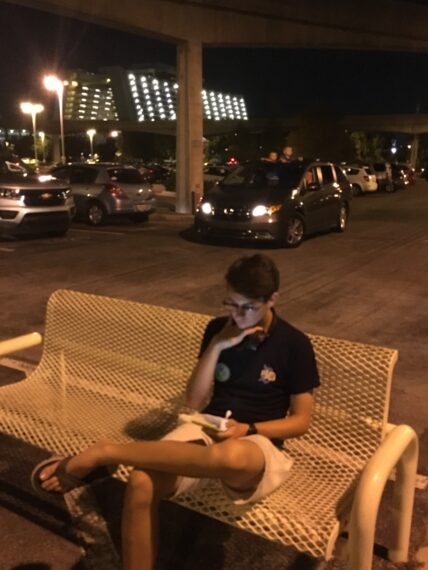 teen sitting on bench at Disney's Contemporary Resort