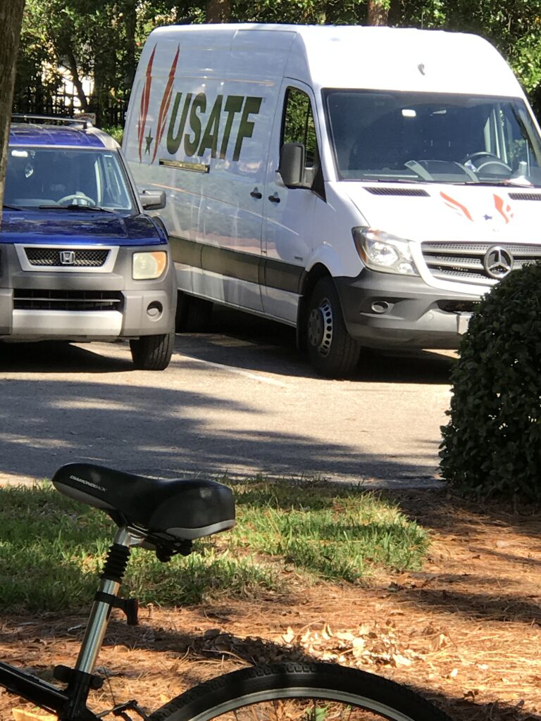 Bicycle parked near USATF van