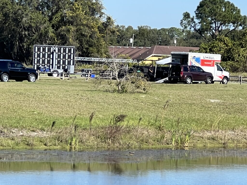 musical stage being erected in a field