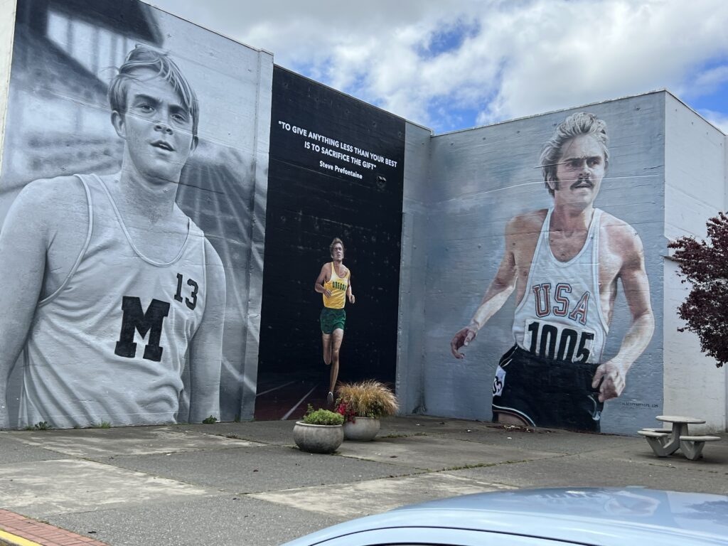 Steve Prefontaine murals on side of build