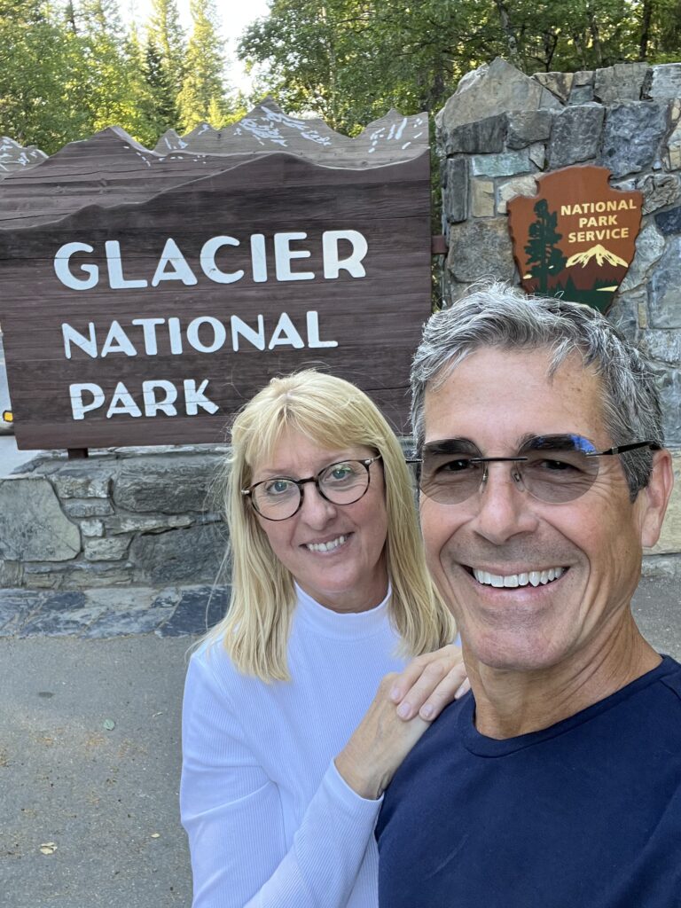 Couple by National park sign