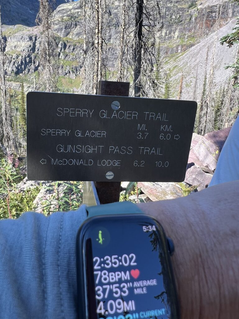 Apple Watch display at trail head sign