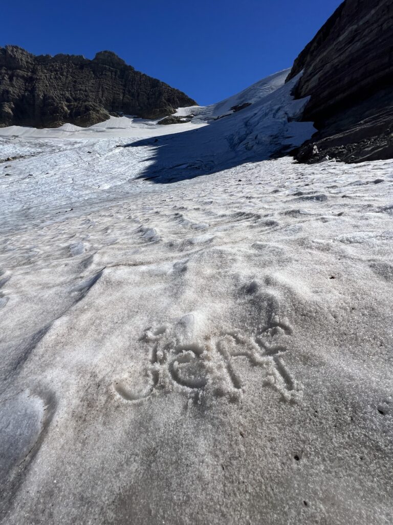 The word Jeff hand written on Glacier snow