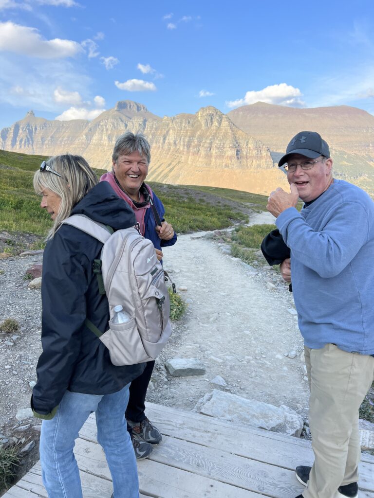 People laughing on a mountain trail