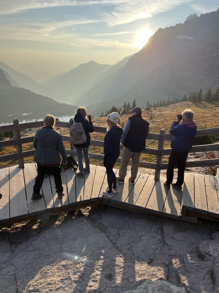 People watching sunset in the mountains