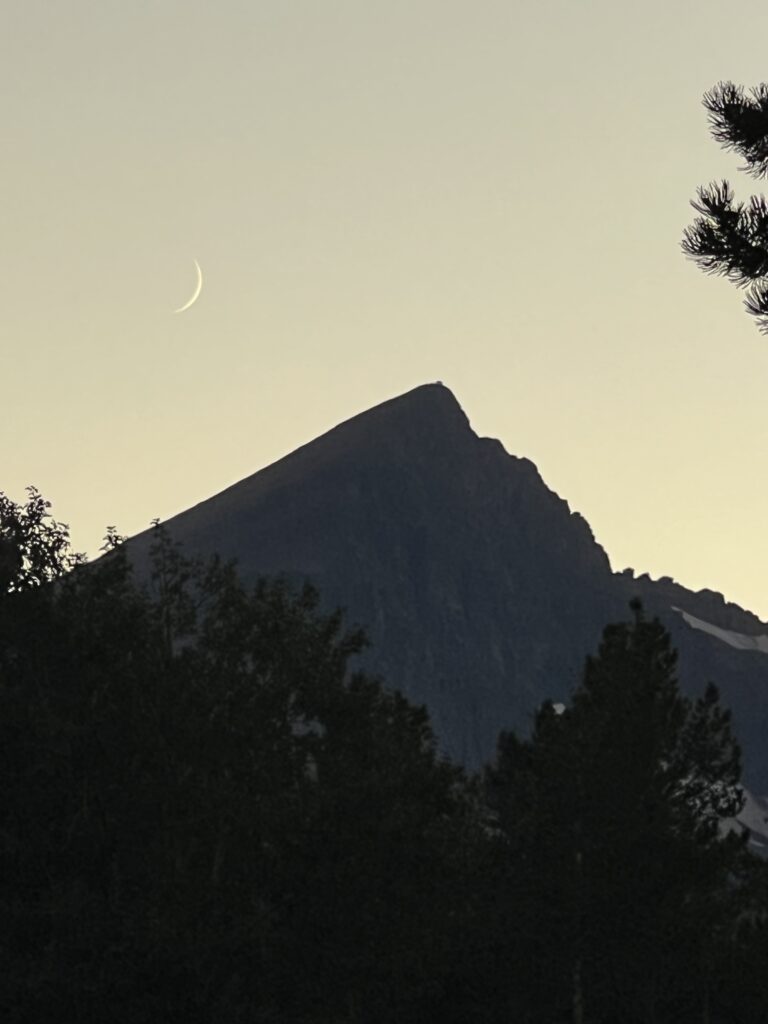 Crescent moon next to Mountain