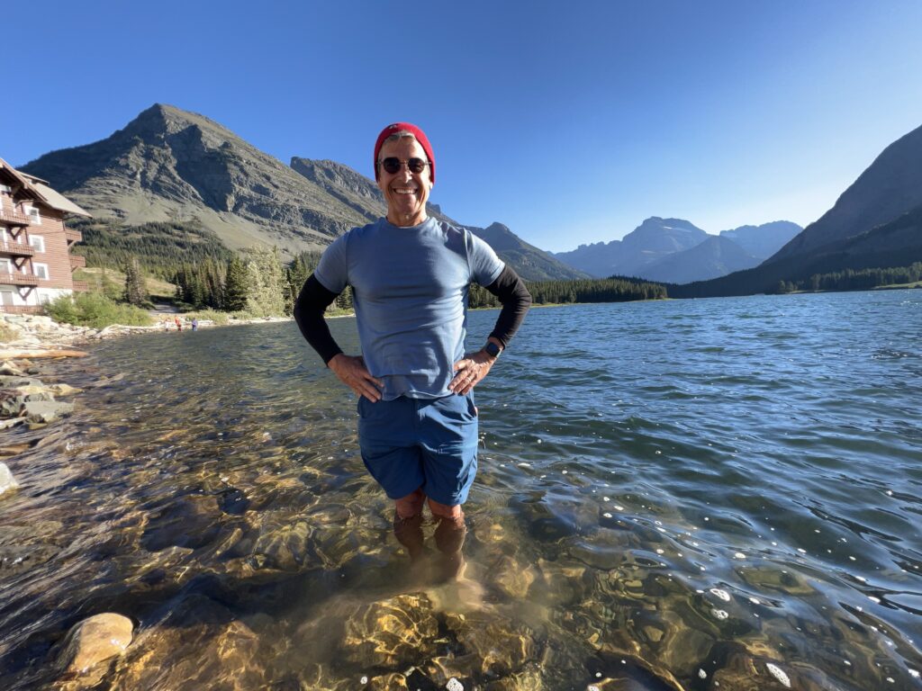 Man standing in a mountain lake