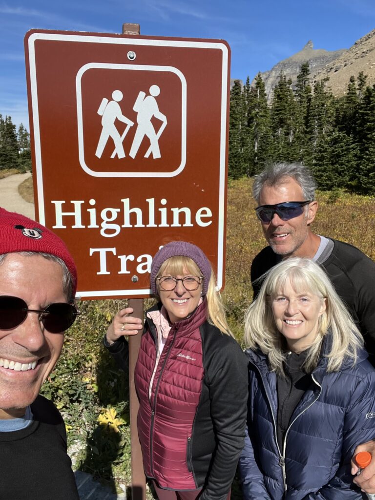 Four people at a trail head