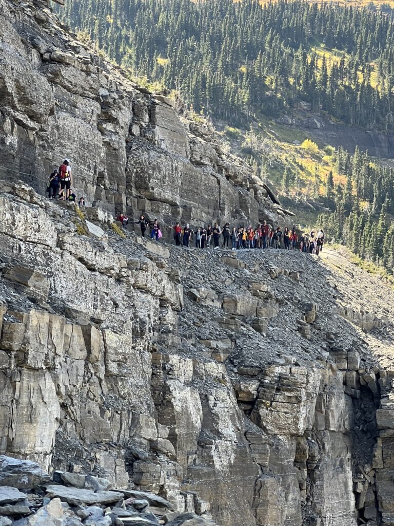 Long line at school students on a hiking trail