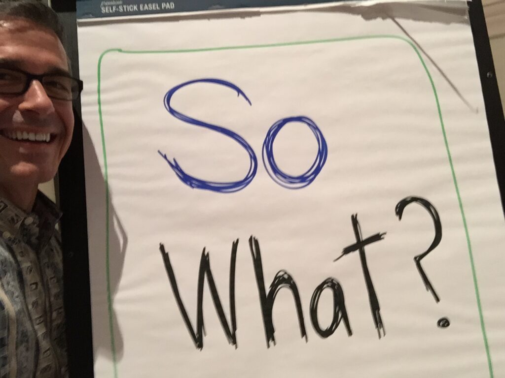 flip chart with 'so what' written on it