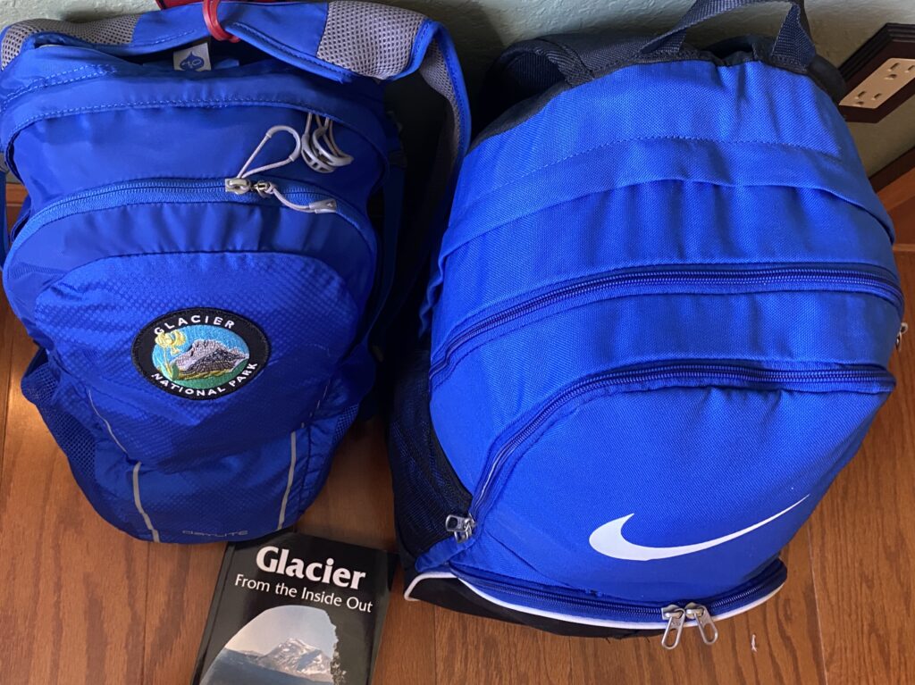 two blue backpacks on floor