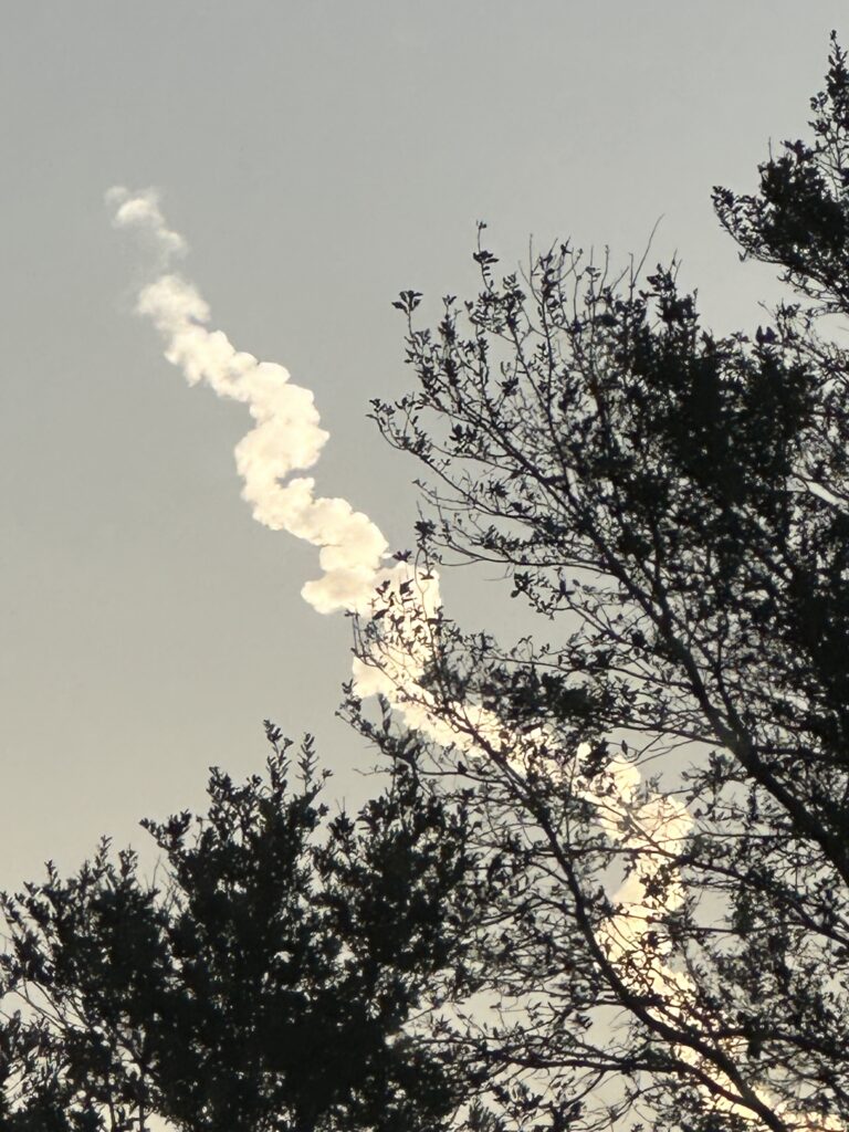 Rocket launch trail of smoke in the sky