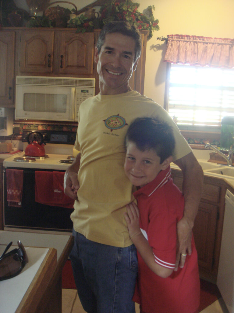 father and young son in kitchen