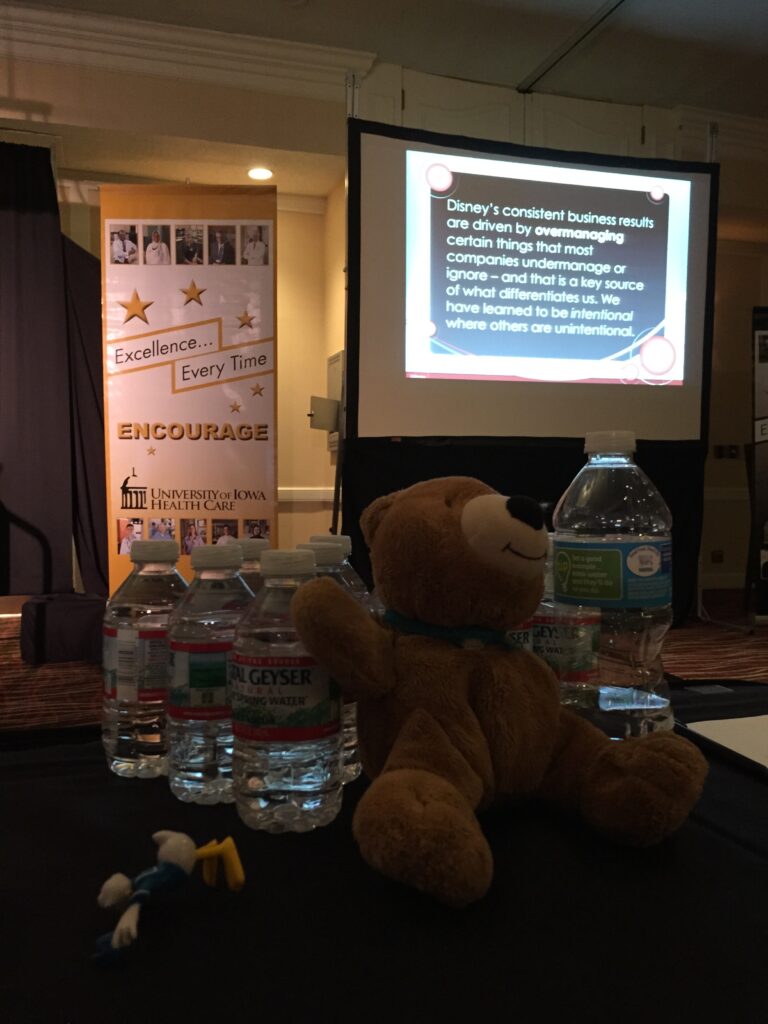 water bottles and a teddy bear in a conference room