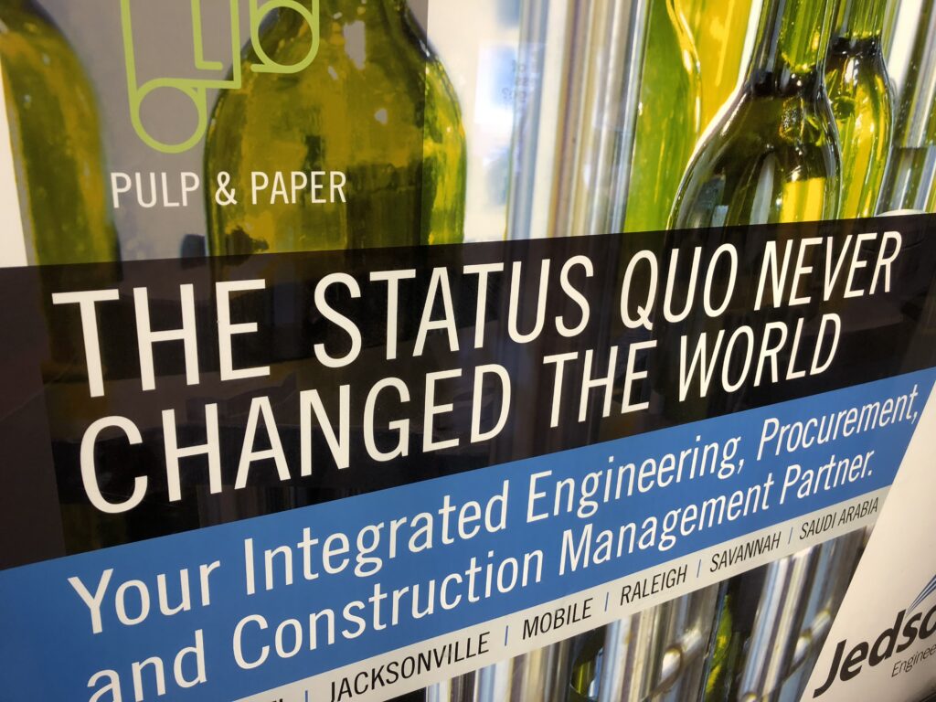 Quote about status quo on a wall