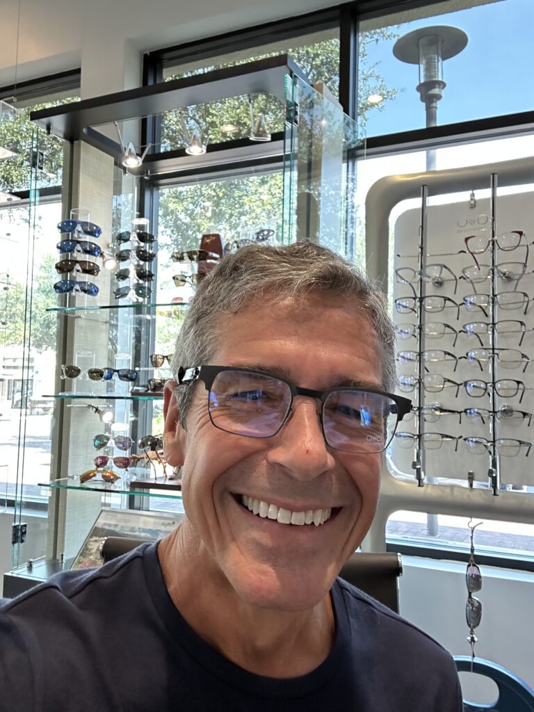 Disney speaker jeff noel trying on glasses