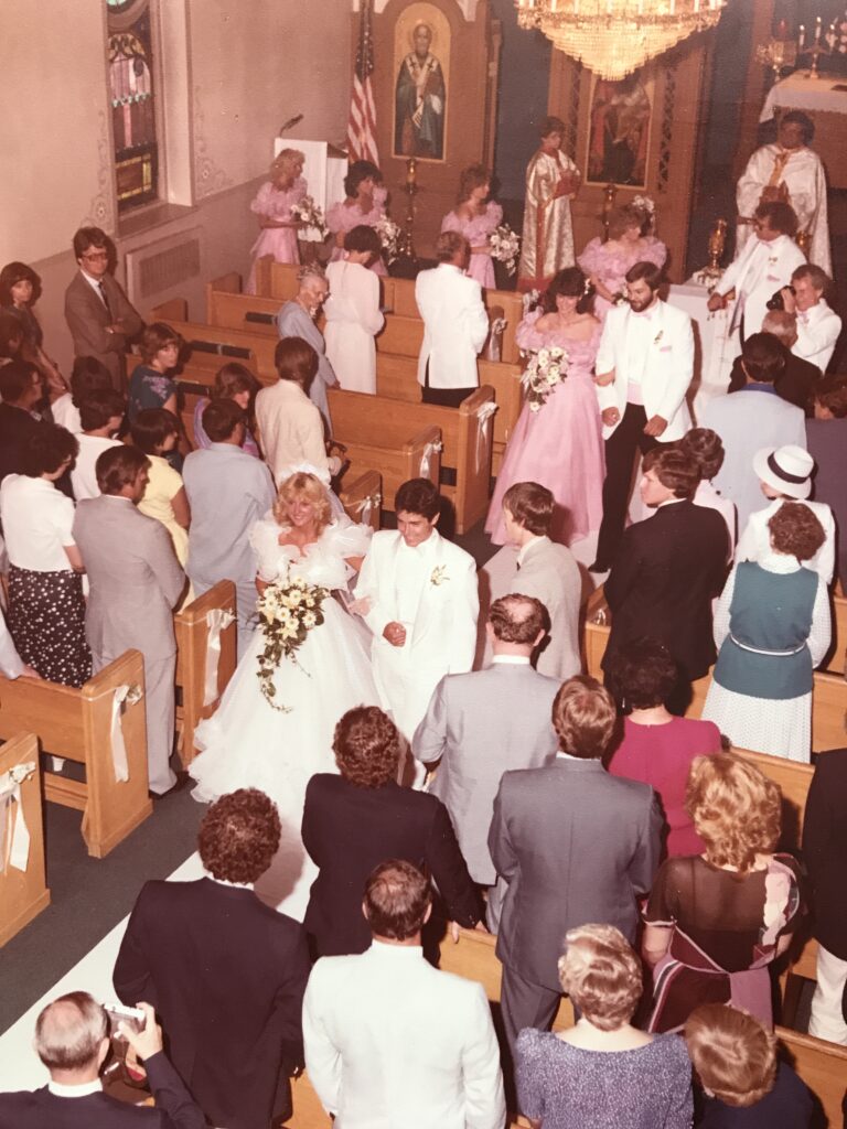 newly married couple walking out of church