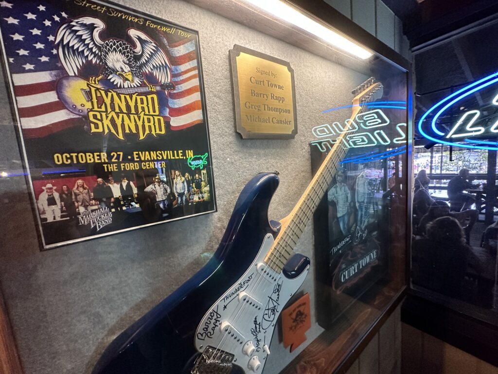 Lynyrd Skynyrd memorabilia on a bar wall