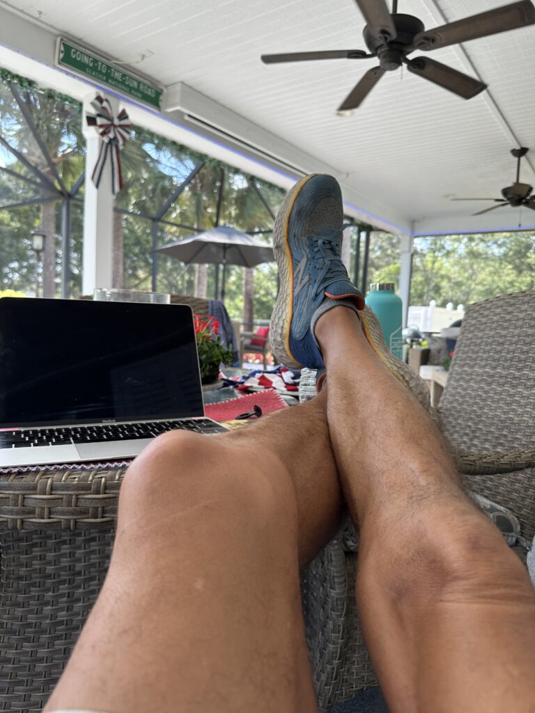 Person with feet up on patio table