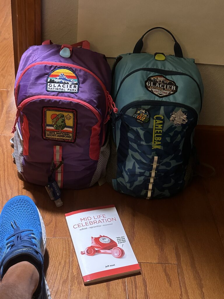 Two small backpacks on the floor