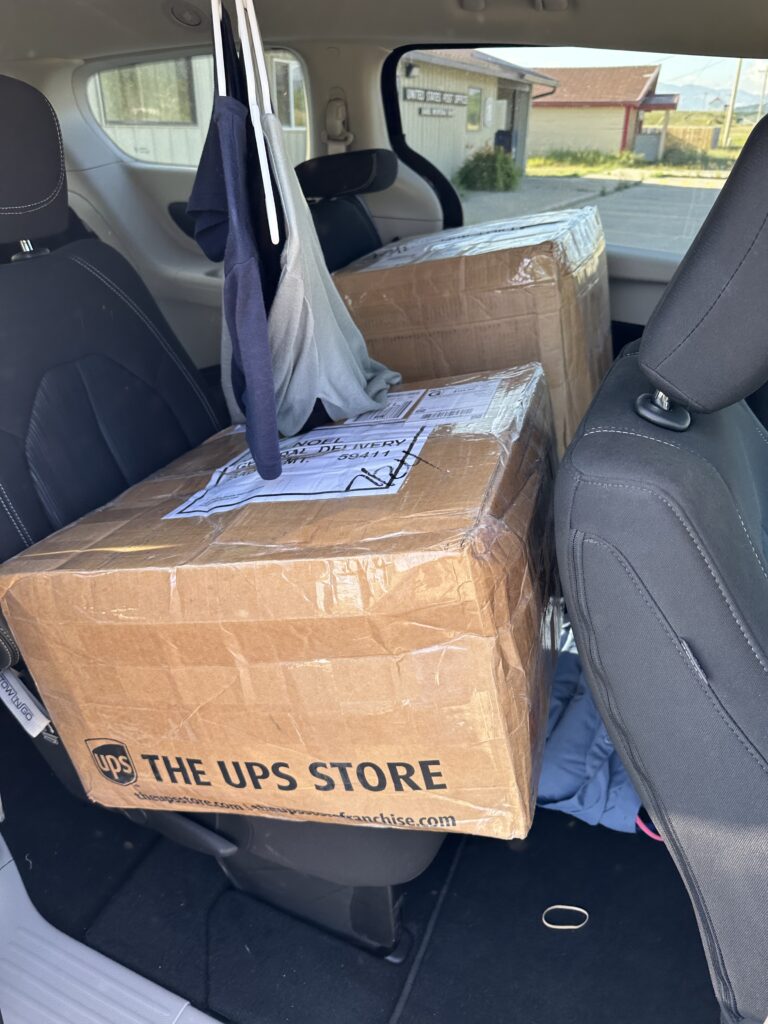 Couple UPS boxes in a vehicle