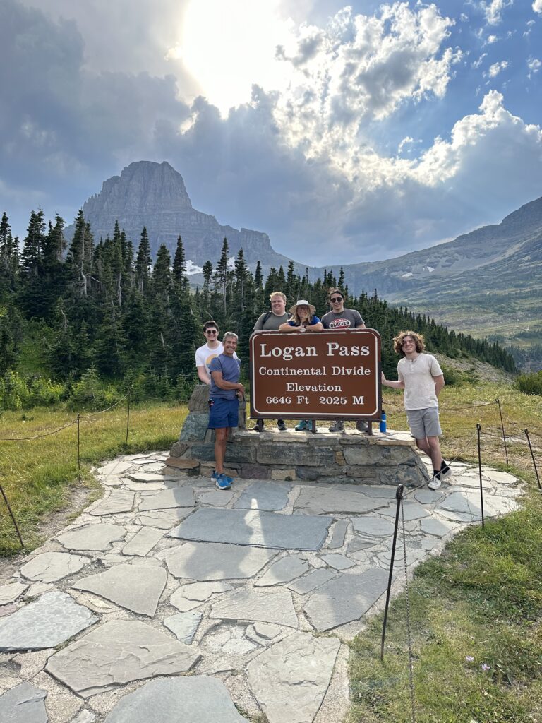 Family posing by National Park sign