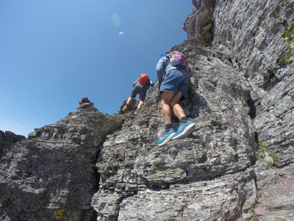 two men climbing a mountain