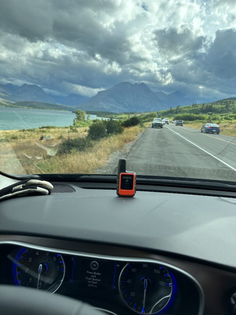 Looking at mountains thru car windshield. 