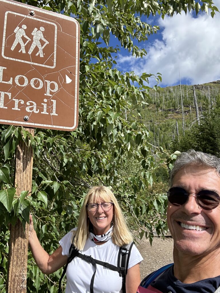 Couple at trailhead sign