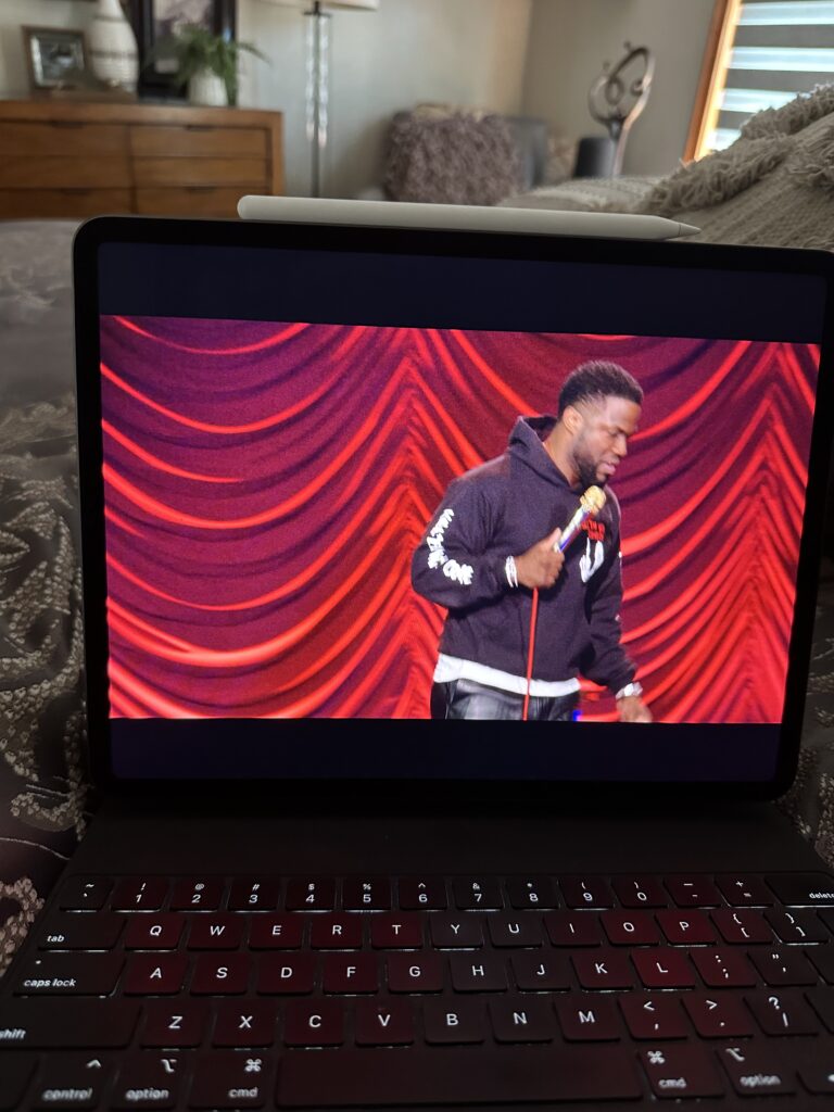 iPad watching Kevin Hart comedy