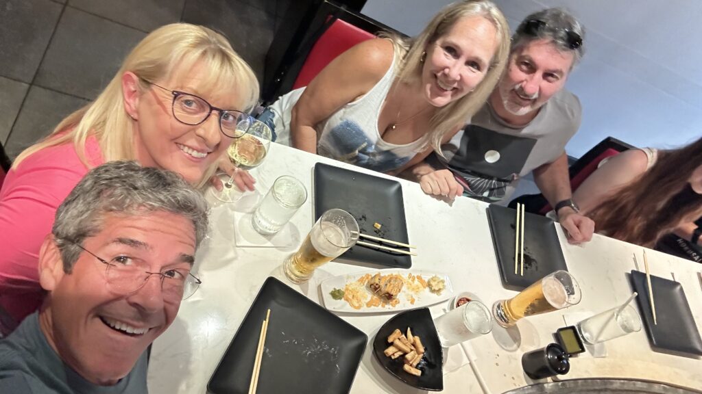 Four people at a Japanese restaurant