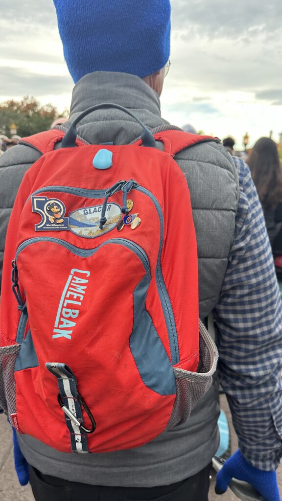 Man walking with red day pack