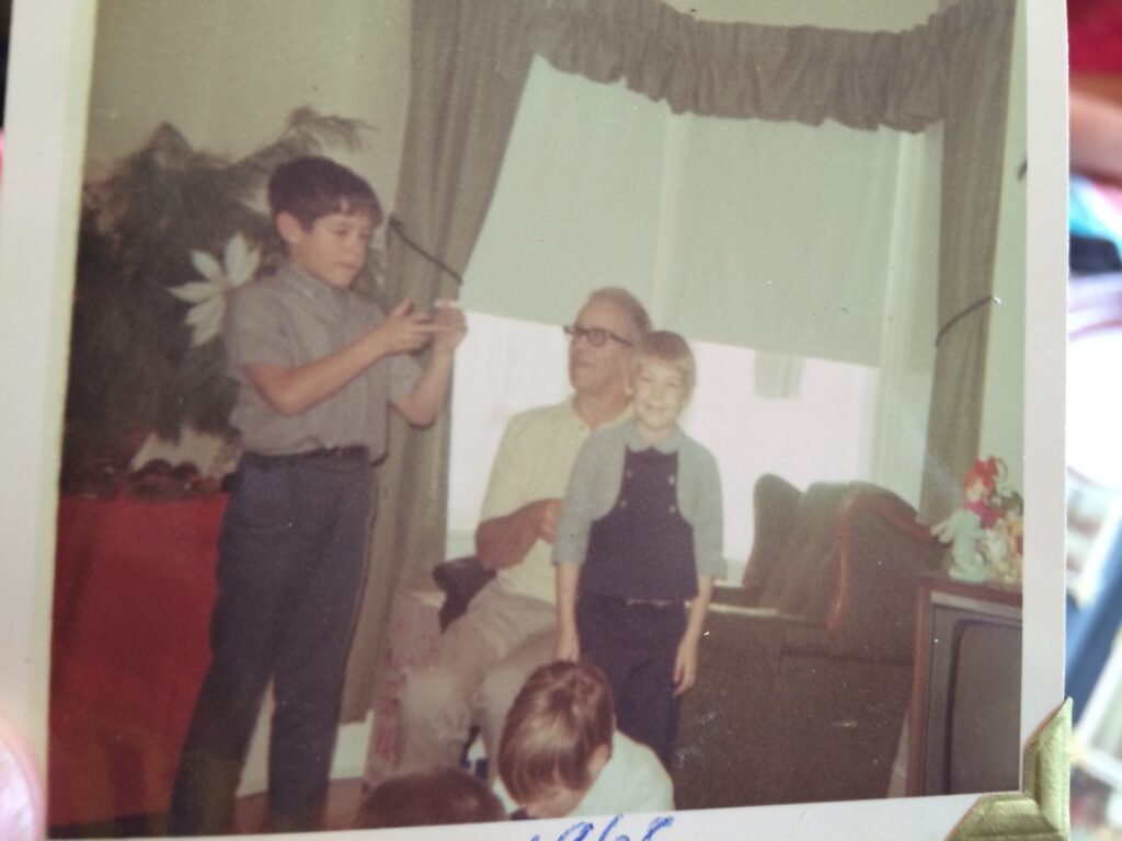 A 1960s photo of two grandchildren and the grandpa