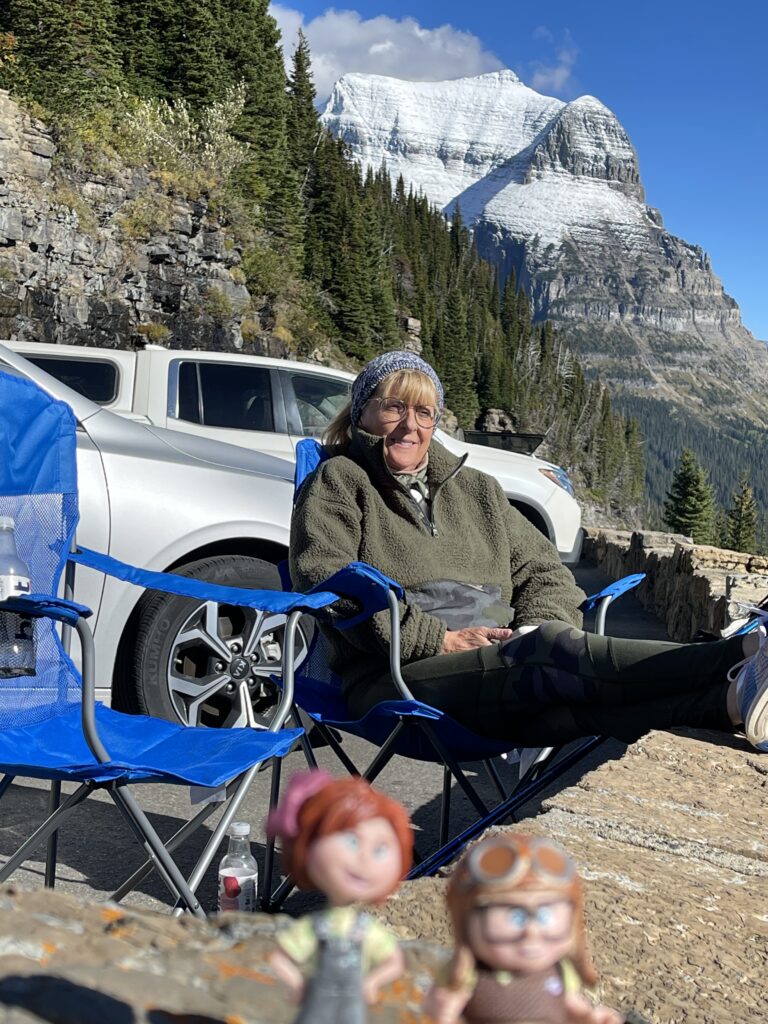 Person sitting in the mountains 