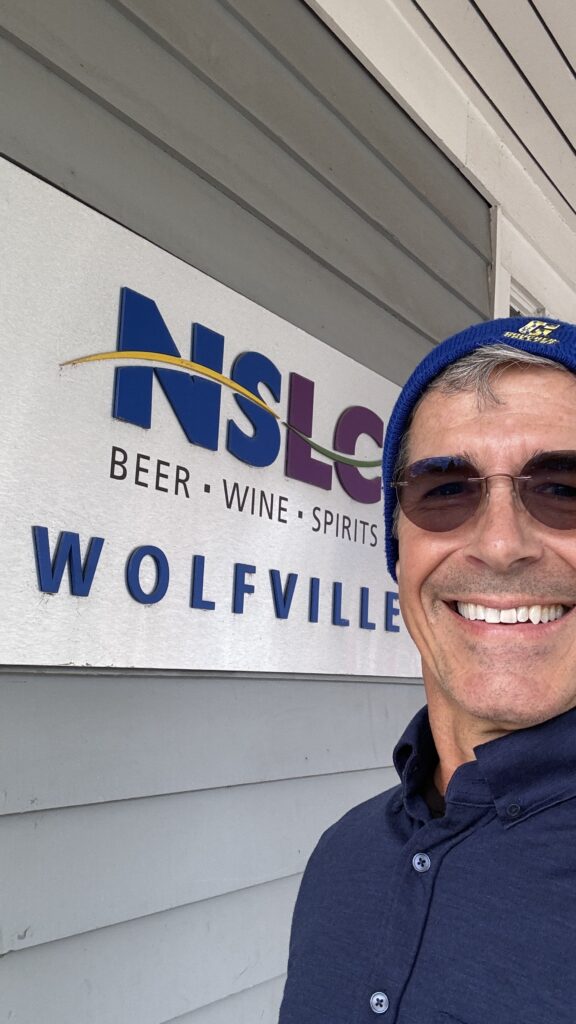 Man in front of a liquor store