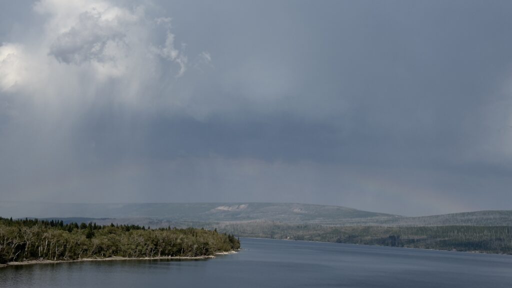 Rainbow at mountain lake 