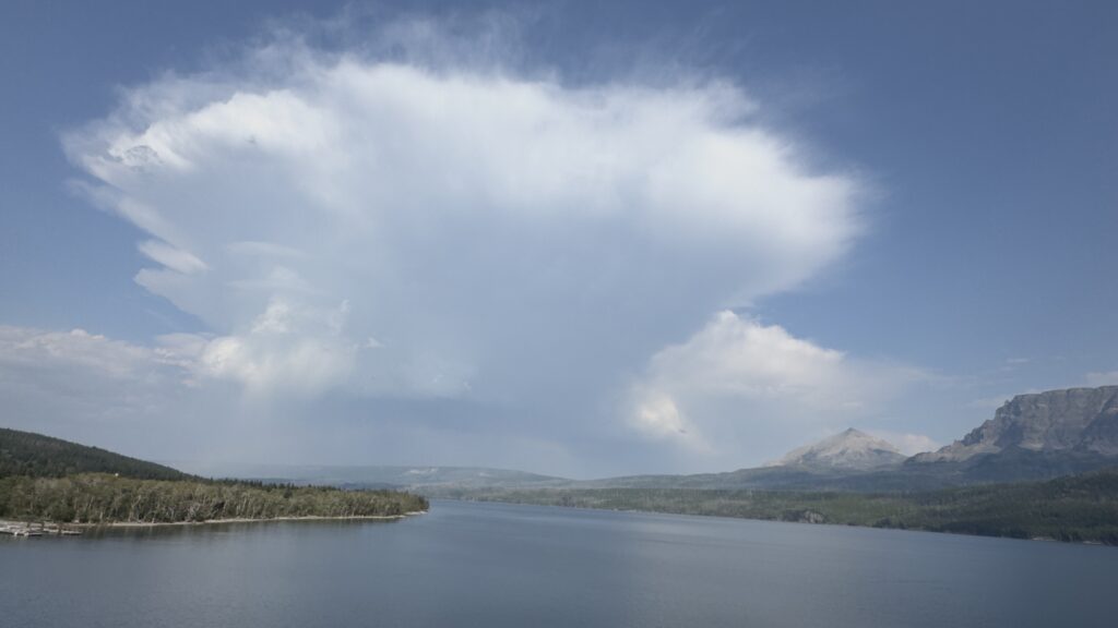Mountain lake and rain storm cloud