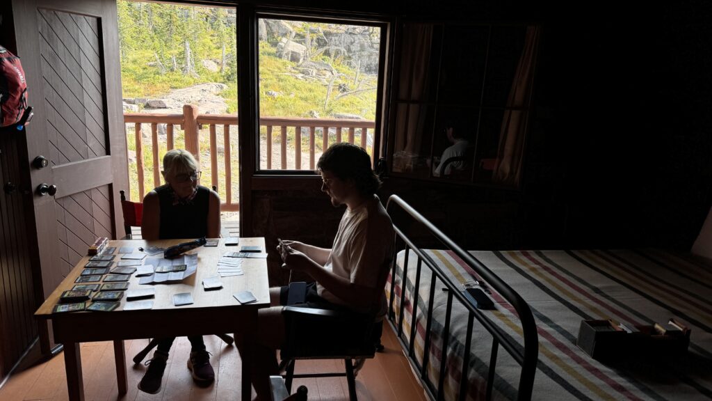 Two people sitting in a mountain chalet room