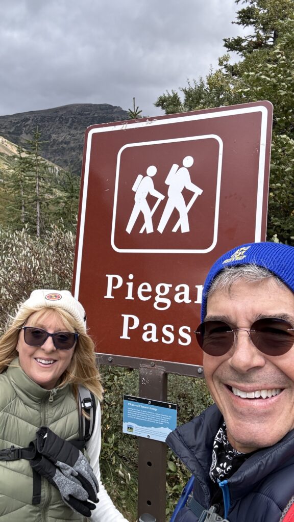 honeymoon couple at trailhead sign
