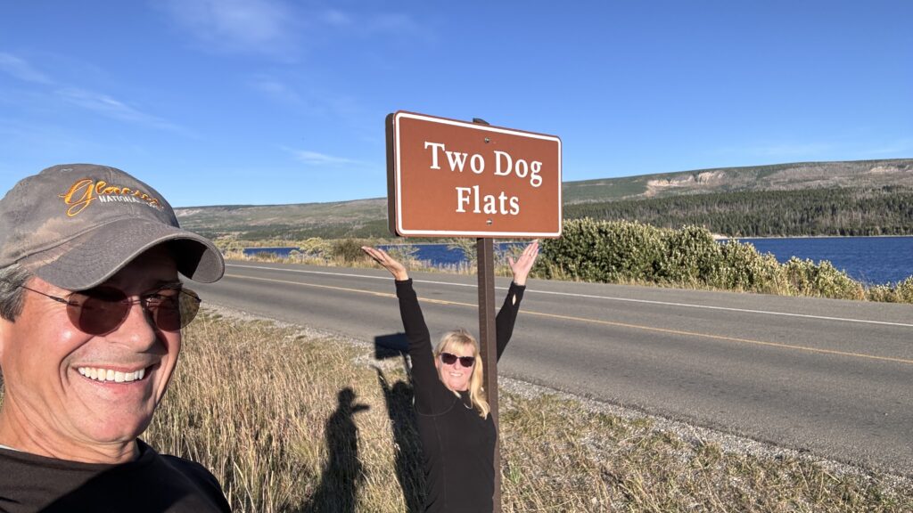 honeymoon couple next to roadside sign