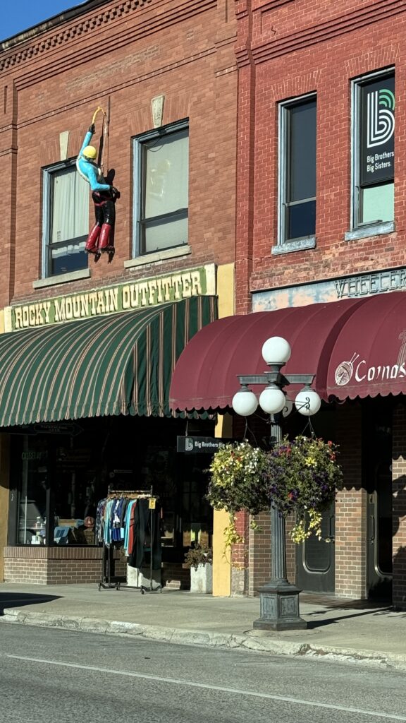 small town brick buildings with a mannequin 