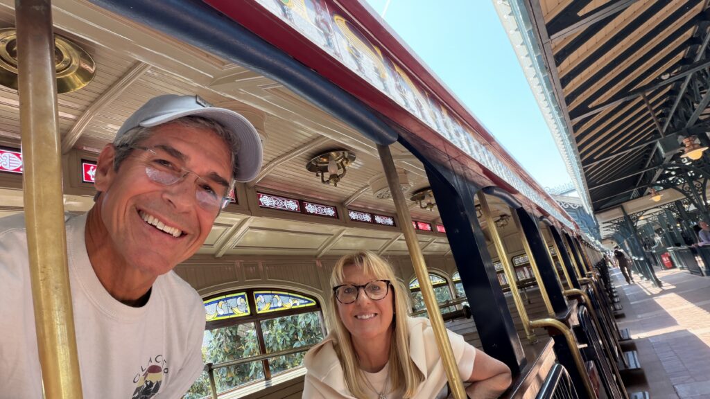 Two Disney retirees on a Disney train