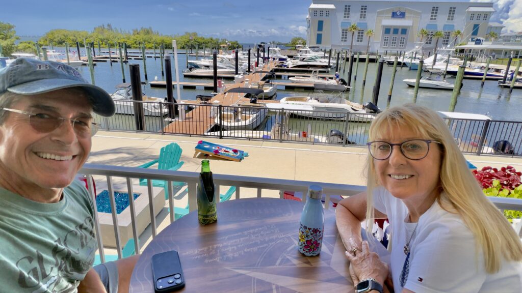 Senior couple sitting beside a marina